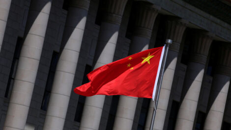 FILE PHOTO: A Chinese flag flutters in front of the Great Hall of the People in Beijing, China, May 27, 2019. REUTERS/Jason Lee